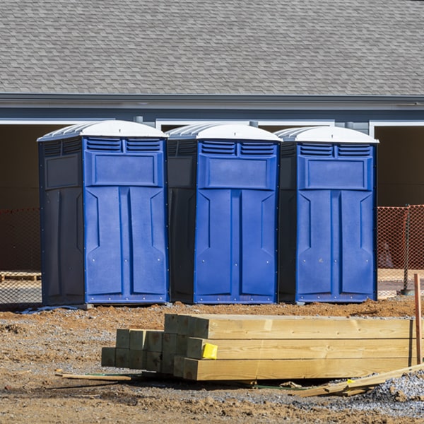 what is the cost difference between standard and deluxe portable restroom rentals in Kerby